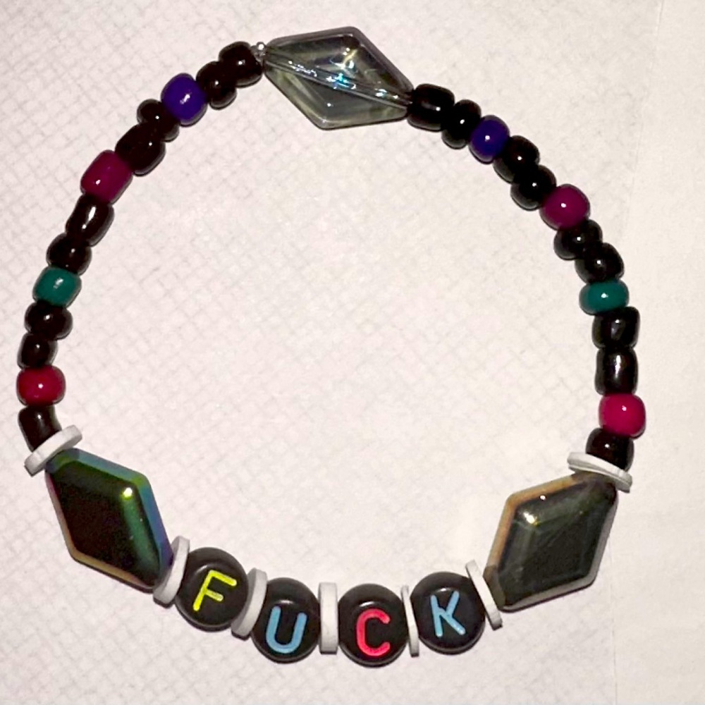 stretchy handmade friendship bracelet with glass and iridescent beads “fxck”